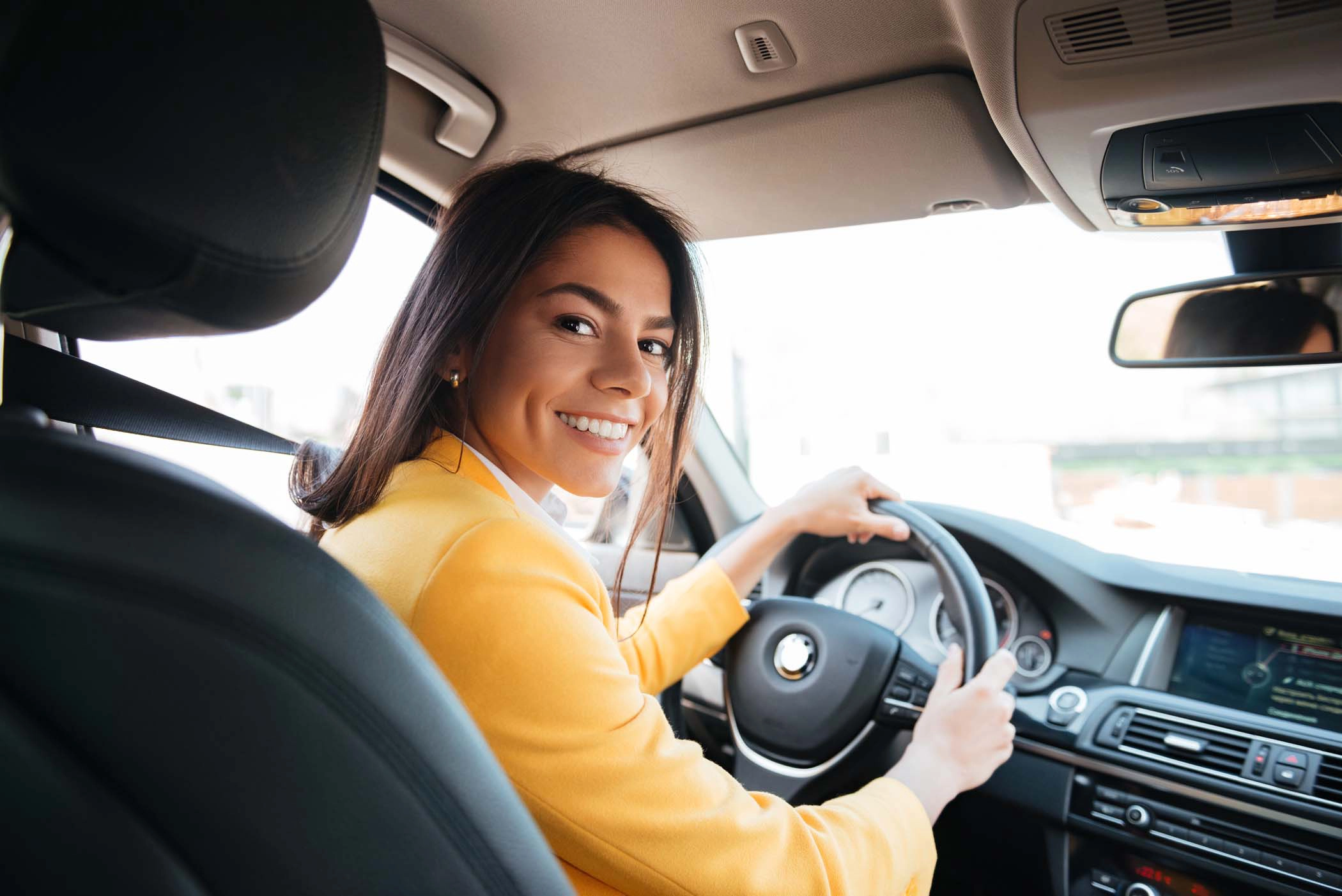 Professional photo of a woman taxi driver driving a Yellow Cab Co. taxi in Des Moines, Iowa